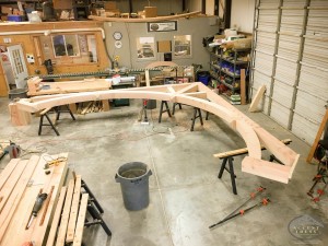 Heavy timber douglas fir curved bottom chord truss. We take pride in our work and pay close attention to detail. These large swooping curves will be sure to draw the eye of anyone walking into a room.